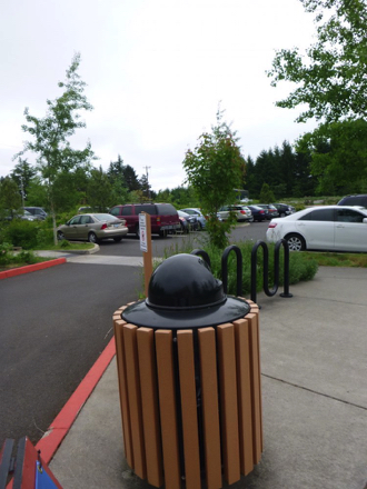 Parking lot has several accessible spaces – sidewalk has a bike rack, trashcan and interpretive signage Parking lot has several accessible spaces – sidewalk has a bike rack, trashcan and interpretive signage